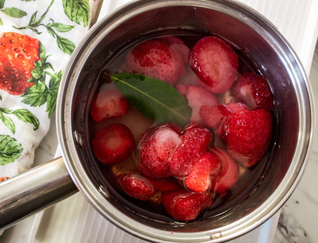 stewed frozen strawberries with bay leaf for yogurt bowls. 