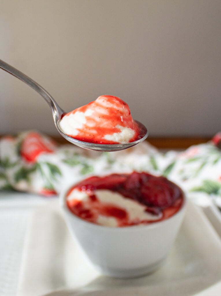 stewed strawberries with bay leaf spooned over yogurt bowls.