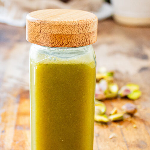 pistachio orgeat in glass jar.