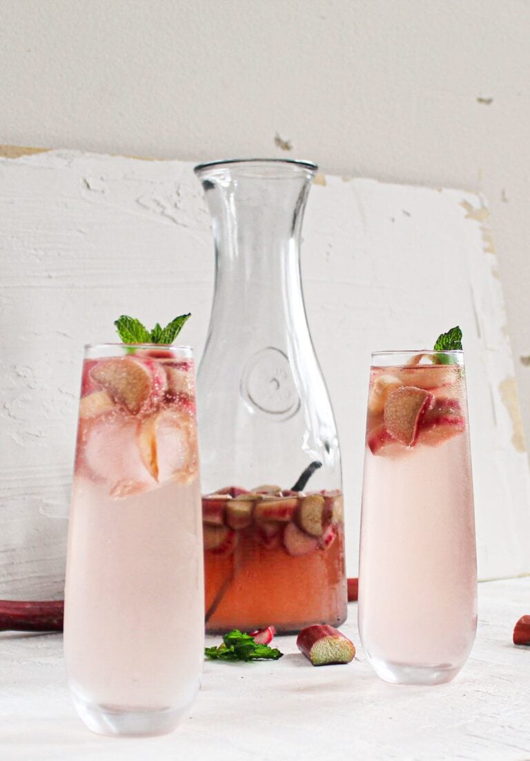 rhubarb sangria in glasses with carafe
