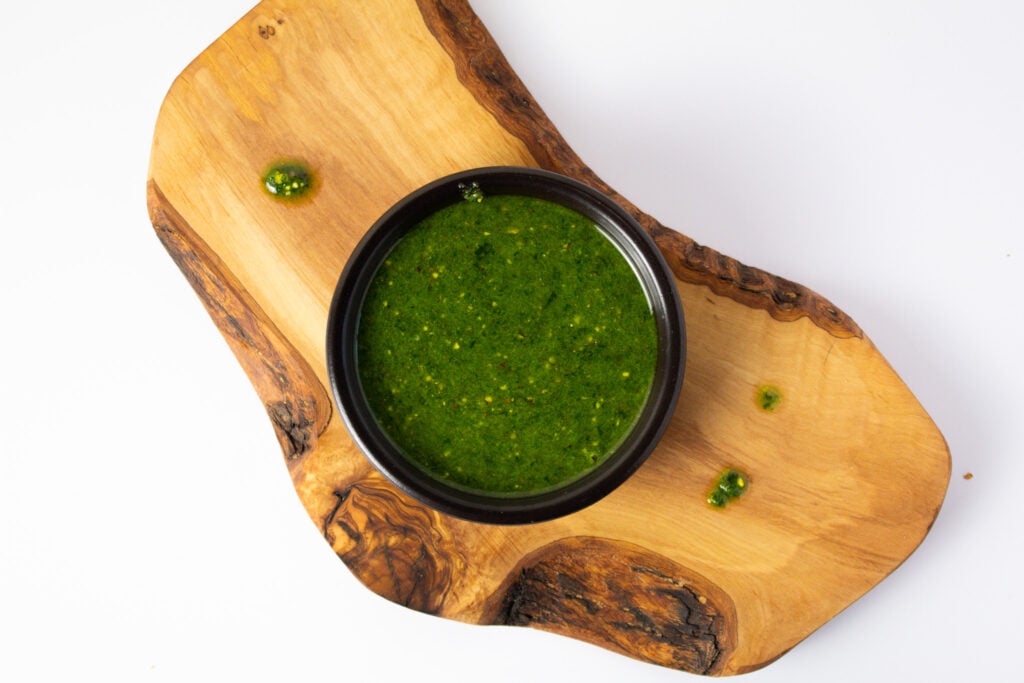 ramp pistachio pesto in bowl on cutting board.  
