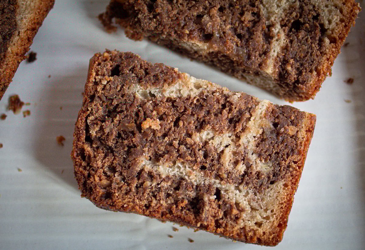 slice of marbled chocolate banana bread on side.