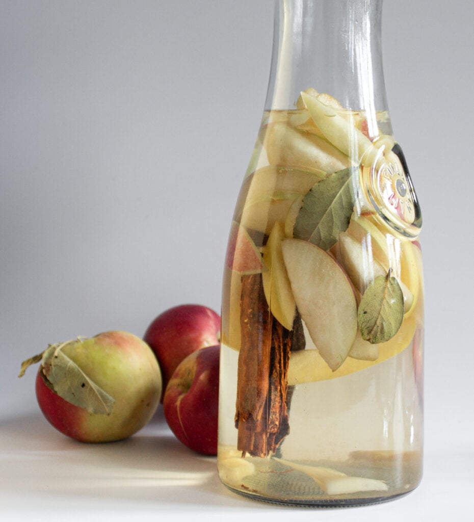 photo of glass carafe filled with spiced apple wine sangria