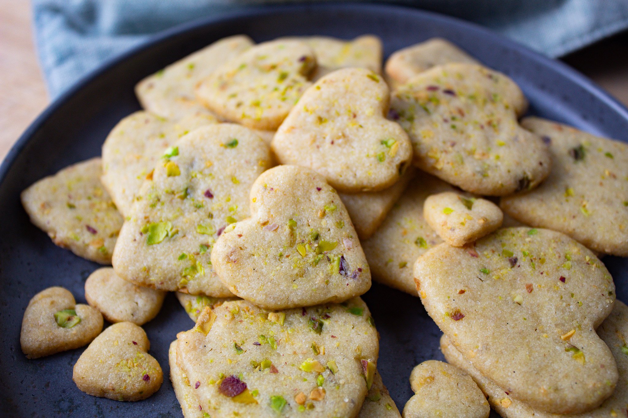 pistachio cookies cut into hearts.