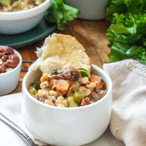 White bean, escarole and sausage soup with mushrooms and hazelnuts