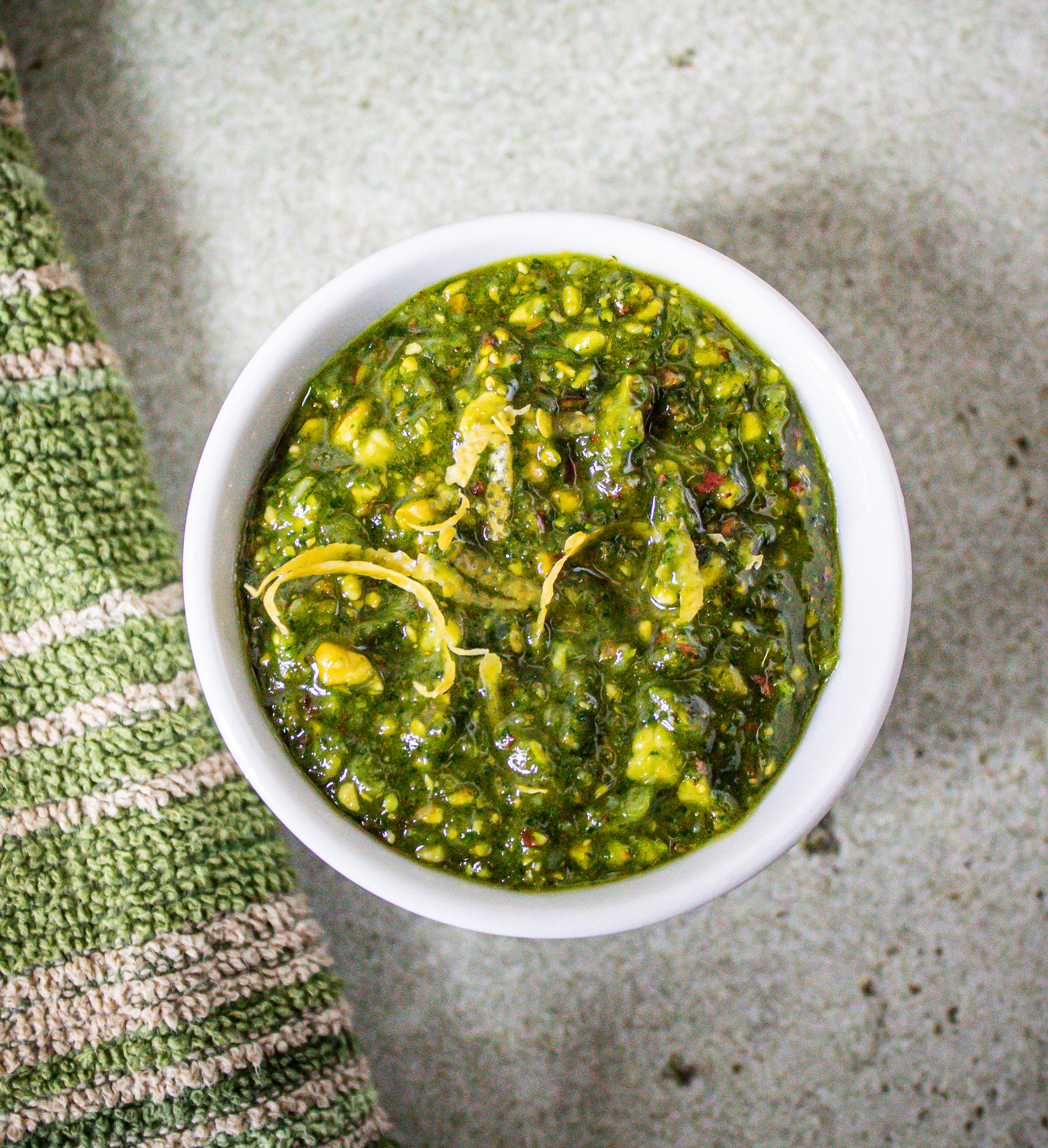 pea shoot pesto in ceramic container.