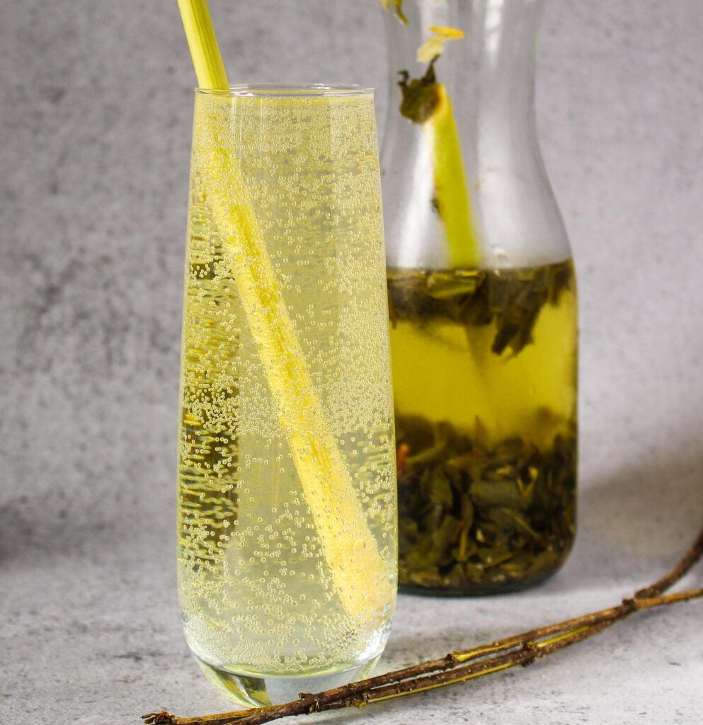 Glass of sparkling botanical green tea with sparkling water.