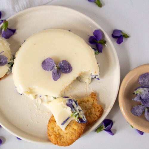 Sugared violets on violet panna cotta.