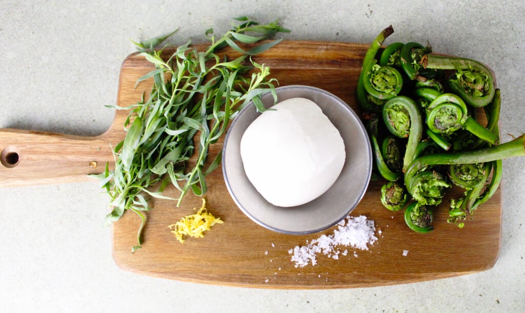Grilled Fiddleheads with Burrata and Tarragon Oil.