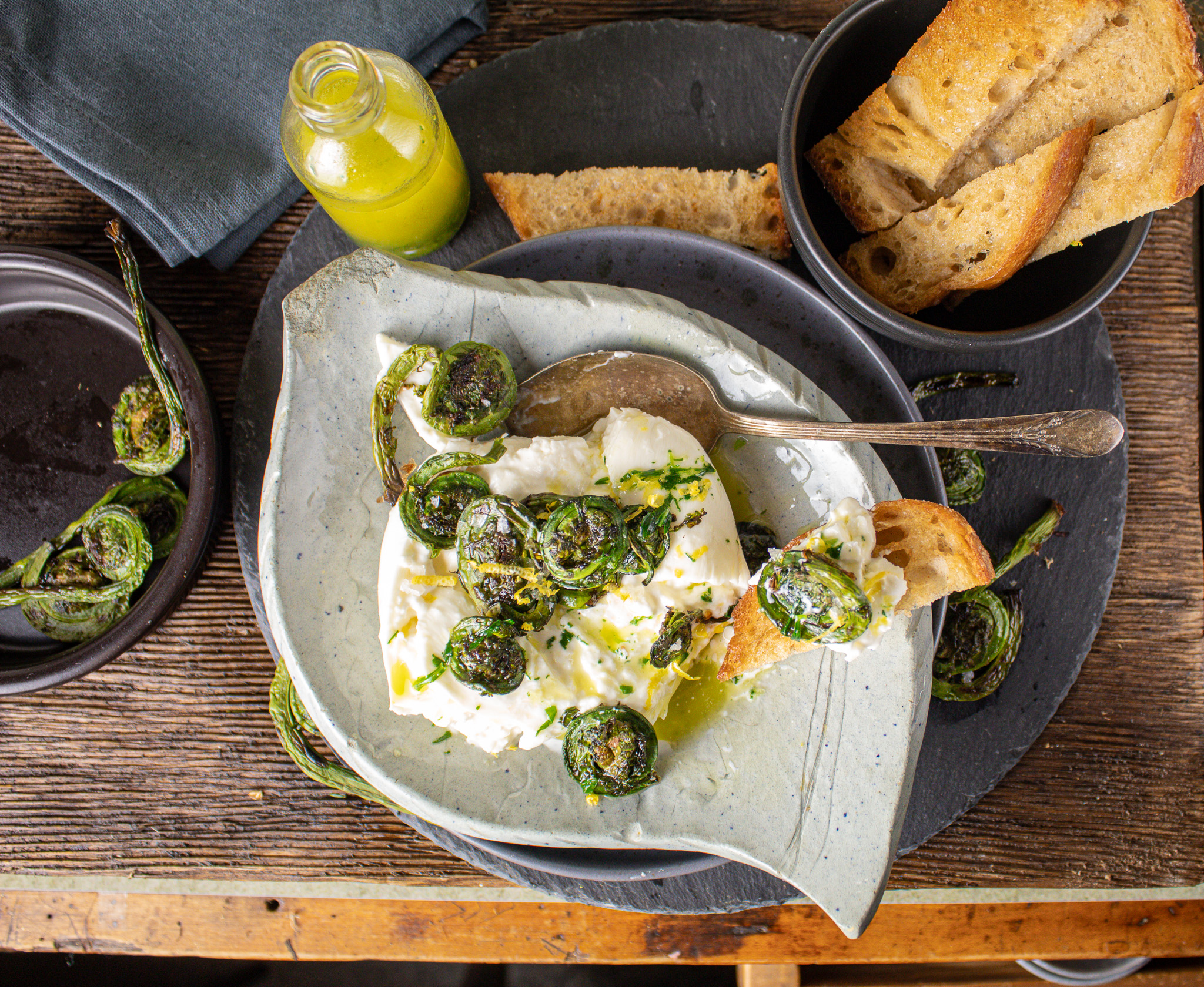 Grilled Fiddleheads with Burrata and Tarragon Oil